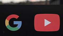 (FILES) In this file photo taken on November 21, 2019, the Google and YouTube logos are seen at the entrance to the Google offices in Los Angeles, California. - YouTube has driven millions of viewers to climate denial videos, a US activist group said on January 16, 2020, as it called for stopping "free promotion of misinformation" at the platform. New York-based Avaaz said it scrutinized results of Google-owned YouTube searches using the terms "global warming," "climate change," and "climate manipulation" to see what was offered by an "up next" feature and as suggestions. (Photo by Robyn Beck / AFP)
