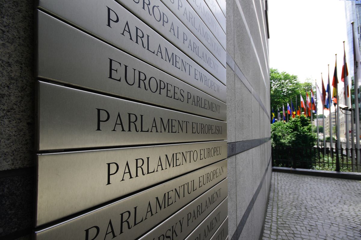 European parliament written in all EU languages, on the front wall of the main building - Brussels, Belgium (Shutterstock)