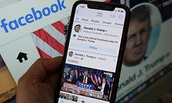 This illustration photo show the Facebook page of former President Donald Trump on a smartphone screen in Los Angeles, March 17, 2023. - Former president Donald Trump wrote his first posts on his reinstated Facebook and YouTube accounts on March 17, 2023, more than two years after he was banned over the US Capitol insurrection. "I'M BACK," Trump said, alongside a 12-second video clip that appeared to show him giving his victory speech after winning the 2016 election, as he exclaimed: "Sorry to keep you waiting -- complicated business." (Photo by Chris DELMAS / AFP)