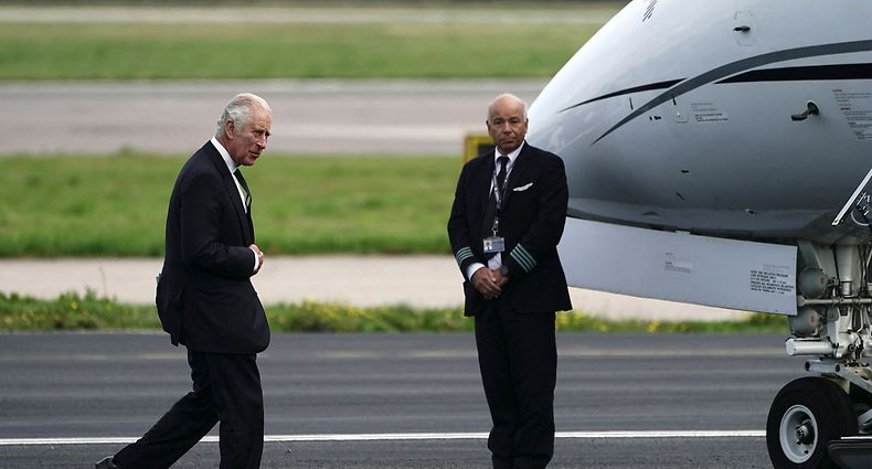 Britain's King Charles III walks to his plane at Aberdeen Airport to travel to London on September 9, 2022, following the death of his mother, Britain's Queen Elizabeth II the previous day. - Queen Elizabeth II, the longest-serving monarch in British history and an icon instantly recognisable to billions of people around the world, died at her Scottish Highland retreat on September 8. (Photo by Aaron Chown / POOL / AFP)
