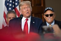 President Donald Trump's personal lawyer Rudy Giuliani listens as US President Donald Trump delivers remarks to the City of New York Police Benevolent Association at the Trump National Golf Club in Bedminster, NJ, on August 14, 2020. (Photo by JIM WATSON / AFP)