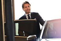 Italy�s Prime Minister Giuseppe Conte guets into his car as he leaves after attending a meeting at the Senate, after he was given by the Italian president a mandate to form a new government, on August 29, 2019 in Rome. - The anti-establishment Five Star Movement (M5S) and the centre-left Democratic Party (PD), once bitter foes, agreed on August 28 to govern in coalition following the collapse of Italy's populist government earlier this month. (Photo by Andreas SOLARO / AFP)