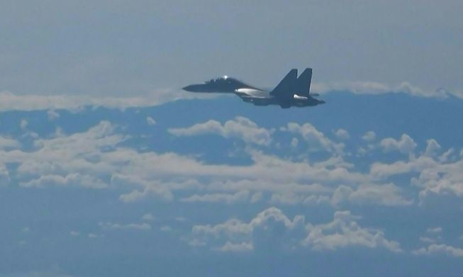This screen grab made from video released by Chinese state broadcaster CCTV shows a Chinese military jet flying as part of military exercises near Taiwan on August 5, 2022. - 