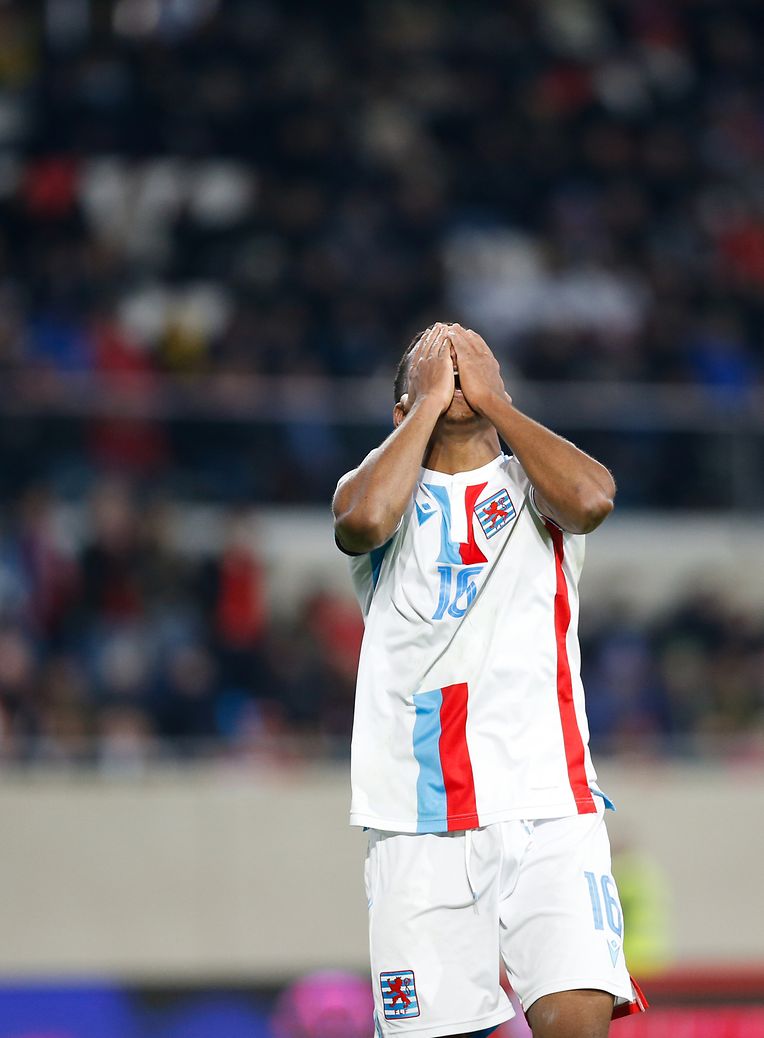 Leandro Barrero folds his arms in front of his face in frustration. 