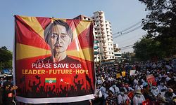 st(FILES) In this file photo taken on February 15, 2021 a banner featuring Aung San Suu Kyi is displayed as protesters take part in a demonstration against the military coup in front of the National League for Democracy (NLD) office in Yangon. - Myanmar's junta-stacked election commission announced on March 28, 2023 that Aung San Suu Kyi's National League for Democracy Party would be dissolved for failing to re-register under a tough new military-drafted electoral law, state media said. (Photo by AFP)