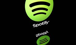 (FILES) This file photo illustration taken on April 19, 2018 in Paris shows the logo of online streaming music service Spotify displayed on a tablet screen. - Music streaming giant Spotify on January 31, 2023 reported a total of 205 million paying subscribers at the end of 2022, beating expectations, but its losses deepened. (Photo by Lionel BONAVENTURE / AFP)