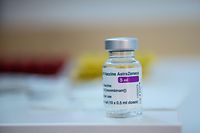 This photograph shows a vial of the AstraZeneca anti-covid-19 vaccine in a pharmacy in Paris on March 12, 2021, as pharmacies have been authorised to give Covid-19 vaccinations - for the first time in the vaccination campaign in France. (Photo by Martin BUREAU / AFP)
