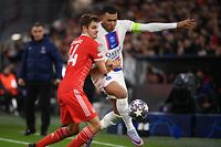 Bayern Munich's German defender Josip Stanisic (L) and Paris Saint-Germain's French forward Kylian Mbappe vie for the ball during the UEFA Champions League round of 16, 2nd-leg football match FC Bayern Munich v Paris Saint-Germain FC in Munich, southern Germany, on March 8, 2023. (Photo by FRANCK FIFE / AFP)