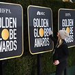 (FILES) In this file photo taken on January 5, 2019, workers and staff prepare the red carpet area for the 76th Golden Globe Awards in Beverly Hills, California. - Hollywood's biggest stars gather on January 5, 2020, for the glitzy Golden Globes, the first major awards show of a packed season that looks set to mark Netflix's coming-of-age in Tinseltown. The celebrity-filled gala in Beverly Hills is billed as the most raucous event in the showbiz calendar, where success helps create buzz ahead of next month's Oscars. (Photo by Mark RALSTON / AFP)