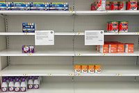 (FILES) In this file photo taken on May 16, 2022 a sign stands next to a small amount of toddler nutritional drink mix at Target in Stevensville, Maryland as a nationwide shortage of baby formula continues due to supply chain crunches tied to the coronavirus pandemic that have already strained the country�s formula stock, an issue that was further exacerbated by a major product recall in February. - The US government will fly in baby formula on commercial planes contracted by the military in an airlift aimed at easing the major shortage plaguing the country, the White House said on May 18, 2022. (Photo by Jim WATSON / AFP)