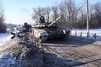 In this handout video released by the Ministry of Defense of the Russian Federation on February 15, 2022, Russian tanks can be seen leaving for Russia after joint exercises of the armed forces of Russia and Belarus as part of an inspection of the Union State Response Force at a training ground near the village of  Brest.  - On February 15, 2022, Russia said it was withdrawing some of its forces near the Ukrainian border to its bases, the first major step toward de-escalation in weeks of crisis with the West.  The move comes amid intense diplomatic efforts to prevent a possible Russian invasion of its pro-Western neighbor and after Moscow massed more than 100,000 troops near Ukraine's borders.  (Photo courtesy of Handout / Russian Ministry of Defense / AFP) / LIMITED FOR EDITORIAL PURPOSES 