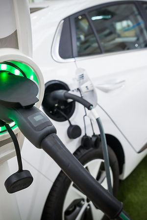 Close up image of the power socket of an electric car, charging.
