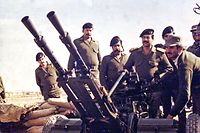 (FILES)--In this photograph made available by the official Iraqi presidential photographer 26 April 2002, Iraqi President Saddam Hussein is seen at the Iraq-Iran border during Iraq-Iran war 1980-1988. Saddam will celebrate his 65th birthday on 28 April. He was born in 1937 in Takrit, in the province of Salahedin, 170 kms north of Baghdad. AFP PHOTO/HO (Photo by PRESIDENTIAL PALACE / AFP)