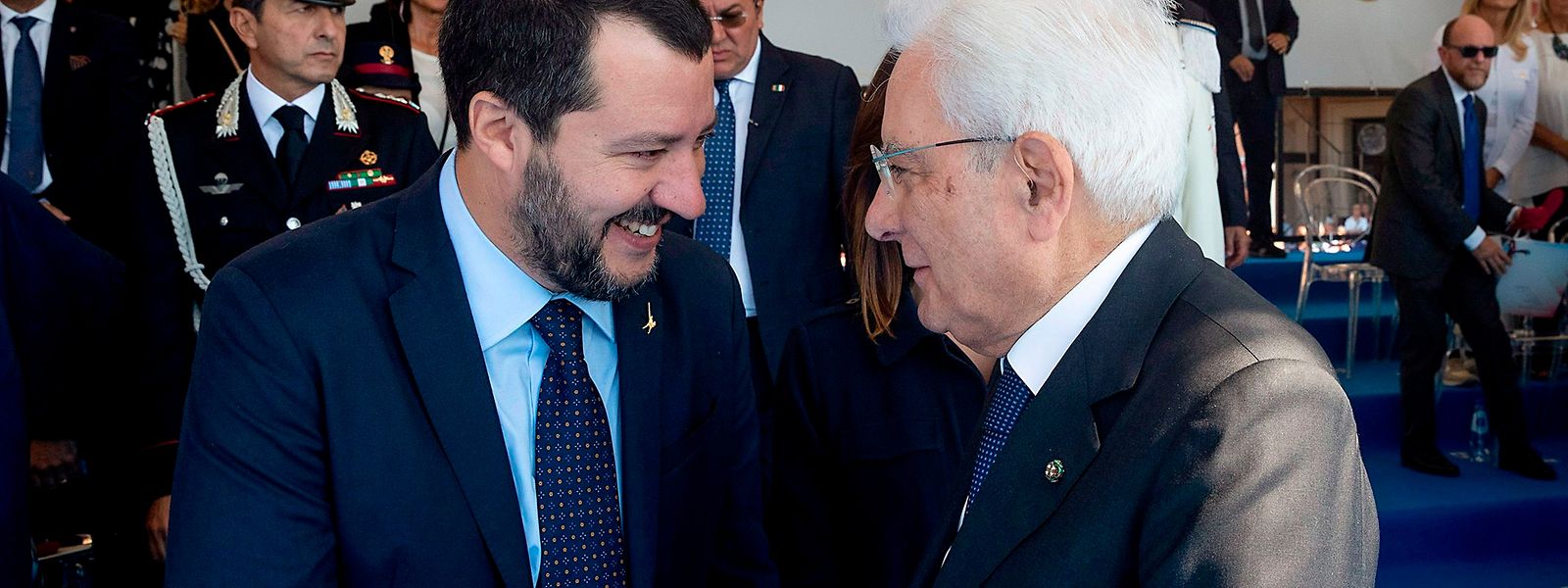 A handout photo made available on September 30, 2018 by the Quirinale Press Office shows Italian President Sergio Mattarella (L) shaking hand with Italy's Deputy Prime Minister and Interior Minister, Matteo Salvini on September 30, 2018 durign a meeting on the occasion of the 50th anniversary of the foundation of the National Association of the State Police, in Ostia, west of Rome. (Photo by Paolo GIANDOTTI / Quirinale Press Office / AFP) / XGTY / RESTRICTED TO EDITORIAL USE - MANDATORY CREDIT "AFP PHOTO / QUIRINALE PRESS OFFICE/PAOLO GIANDOTTI" - NO MARKETING NO ADVERTISING CAMPAIGNS - DISTRIBUTED AS A SERVICE TO CLIENTS