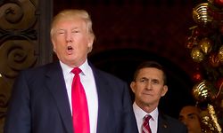 (FILES) In this file photo taken on December 21, 2016 US President-elect Donald Trump (L) stands with Trump National Security Adviser designate Lt. General Michael Flynn (R) at Mar-a-Lago in Palm Beach, Florida. - US President Donald Trump in a tweet announced on November 25, 2020, he has pardoned his former national security advisor Michael Flynn. Flynn pleaded guilty in 2017 to lying to the FBI over his Russian contacts. (Photo by JIM WATSON / AFP) / XGTY