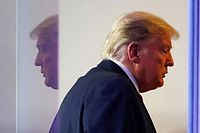 TOPSHOT - US President Donald Trump departs after speaking at the daily briefing on the novel coronavirus, which causes COVID-19, in the Brady Briefing Room at the White House on April 13, 2020, in Washington, DC. (Photo by MANDEL NGAN / AFP)
