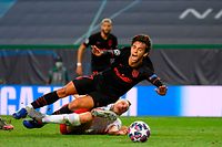 Atletico Madrid's Portuguese forward Joao Felix (L) is fouled by Leipzig's German defender Lukas Klostermann during the UEFA Champions League quarter-final football match between Leipzig and Atletico Madrid at the Jose Alvalade stadium in Lisbon on August 13, 2020. (Photo by LLUIS GENE / various sources / AFP)