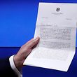 European Council President Donald Tusk shows British Prime Minister Theresa May's Brexit letter in notice of the UK's intention to leave the bloc under Article 50 of the EU's Lisbon Treaty, at the end of a news conference in Brussels, Belgium March 29, 2017. REUTERS/Yves Herman     TPX IMAGES OF THE DAY