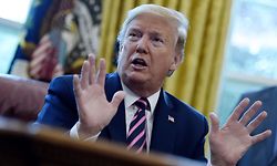 US President Donald Trump answers reporters questions after signing the Paycheck Protection Program and Health Care Enhancement Act in the Oval Office of the White House in Washington, DC, on April 24, 2020. - The $483 billion stimulus act will back small businesses on the brink of bankruptcy, and allocate more money for health-care providers and virus testing. (Photo by Olivier DOULIERY / AFP)