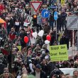 Protestors take part in a march demanding the compliance of basic rights and an end of the restrictive coronavirus measures in Kassel, central Germany, on March 20, 2021. - Several thousand critics and so-called 'Querdenker' from all over Germany were expected to take part in the protest organised by the group 'Freie Buerger Kassel'. (Photo by ARMANDO BABANI / AFP)