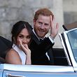 Britain's Prince Harry, Duke of Sussex, (R) and Meghan Markle, Duchess of Sussex, (L) leave Windsor Castle in Windsor on May 19, 2018 in an E-Type Jaguar after their wedding to attend an evening reception at Frogmore House.  / AFP PHOTO / POOL / Steve Parsons