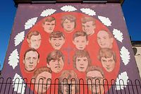 A picture taken on January 17, 2022 shows a mural entitled "Bloody Sunday Commemoration" made by the Bogside Artists in the Bogside area of Londonderry (Derry) in Northern Ireland. - Families mourning fathers and sons killed by British soldiers on "Bloody Sunday" have long battled to prove their relatives' innocence and still hope to see justice served. (Photo by Paul Faith / AFP) / RESTRICTED TO EDITORIAL USE - MANDATORY MENTION OF THE ARTIST UPON PUBLICATION - TO ILLUSTRATE THE EVENT AS SPECIFIED IN THE CAPTION
