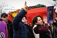 Members of the Kurdish community carry the flag-drapped coffin of on of the three Enghien Street shooting victims during a funeral service, in Paris' northern suburb of Villiers-le-Bel, on January 3, 2023. - Three people were killed and three injured in a shooting on Enghien Street in central Paris on December 23, 2022, police and prosecutors said, adding that the shooter had been arrested. A 69-year-old French man has confessed to a "pathological" hatred for foreigners, Paris prosecutor Laure Beccuau said on December 25, 2022. (Photo by Bertrand GUAY / AFP)