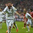 Real Madrid's defender Sergio Ramos celebrates after scoring the 0-2 during the UEFA Champions League second-leg semi-final football match FC Bayern Munich vs Real Madrid CF in Munich, southern Germany, on April 29, 2014.   AFP PHOTO / ODD ANDERSEN