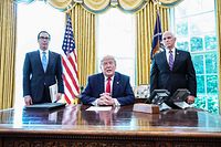 US President Donald Trump meets with US Vice President Mike Pence(R) and US Secretary of Treasury Steven Mnuchin at the White House on June 24, 2019, before signing 'hard-hitting sanctions' on Iran's supreme leader. (Photo by MANDEL NGAN / AFP)