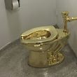 (FILES): This file photo taken on September 15, 2016 shows a fully functioning solid gold toilet, made by Italian artist Maurizio Cattelan, which was going into public use at the Guggenheim Museum in New York. 
The request was for a Van Gogh to adorn the walls of the president and first lady's private residence in the White House.� The answer? No -- but how about a fully functioning, 18-karat gold toilet instead? While it's customary for US presidents to borrow works of art during their time in office, the Guggenheim in Donald Trump's hometown of New York was polite, but firm in its refusal, The Washington Post reported. When the White House requested the renowned Dutch painter's "Landscape With Snow," the museum's chief curator -- an outspoken Trump critic -- countered that the 19th century painting was "prohibited from travel except for the rarest of occasions."
"We are sorry not to be able to accommodate your original request," wrote Nancy Spector in an email obtained by the Post, "but remain hopeful that this special offer may be of interest." Italian artist Maurizio Cattelan's "America" -- a gleaming gold toilet -- was on display at the Guggenheim for nearly a year, installed in a restroom for the private use of members of the public with a guard posted outside.  / AFP PHOTO / William EDWARDS