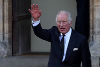 TOPSHOT - Britain's King Charles III waves as he arrives to visit Cardiff Castle, in south Wales on September 16, 2022. - King Charles III heads to Wales for the last of his visits to the four nations of the United Kingdom as preparations for the queen's state funeral gather pace. (Photo by Adrian DENNIS / AFP)