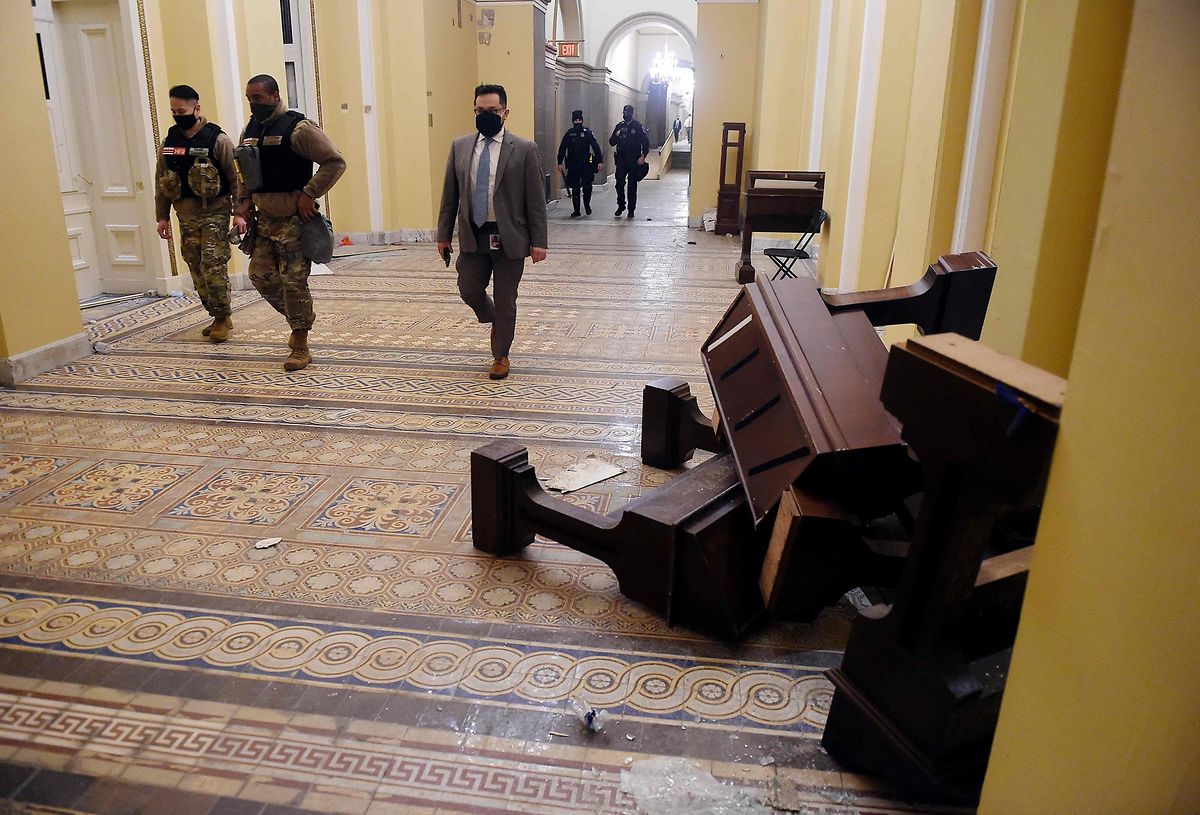 Damage inside the US Capitol building after supporters of Donald Trump stormed the complex 