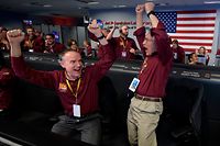 Mars InSight team members Kris Bruvold (L) and Sandy Krasner react after receiving confirmation that the Mars InSight lander successfully touched down on the surface of Mars on November 26, 2018, inside the Mission Support Area at NASA's Jet Propulsion Laboratory in Pasadena, California. - Cheers and applause erupted at NASA's Jet Propulsion Laboratory as a $993 million unmanned lander, called InSight, touched down on the Red Planet and managed to send back its first picture. (Photo by Bill INGALLS / NASA / AFP) / RESTRICTED TO EDITORIAL USE - MANDATORY CREDIT "AFP PHOTO / NASA/ BILL INGALLS" - NO MARKETING NO ADVERTISING CAMPAIGNS - DISTRIBUTED AS A SERVICE TO CLIENTS