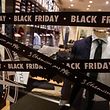 (FILES) This file photo taken on November 27, 2019 shows price reduction signs for Black Friday sales at a store in Caen, northwestern France.  - Black Friday is a sales offer from the United States where retailers slash prices the day after Thanksgiving.  (Photo by Sameer Al-DOUMY / AFP)