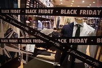 (FILES) In this file photo taken on November 27, 2019 shows price markdown signs for Black Friday sales in a shop in Caen, northwestern France. - Black Friday is a sales offer originating from the US where retailers slash prices on the day after the Thanksgiving holiday. (Photo by Sameer Al-DOUMY / AFP)