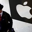 A customer enters the new Apple store, which is the world's largest, on its opening day at Covent Garden in London August 7, 2010. REUTERS/Suzanne Plunkett/File Photo