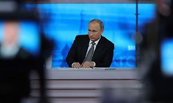 Russian President Vladimir Putin listens to a question during his annual televised call-in show in central Moscow on April 14, 2016. / AFP PHOTO / SPUTNIK / MIKHAIL KLIMENTYEV