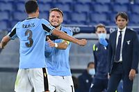 Lazio's Brazilian defender Luiz Felipe (L) celebrates with Lazio's Italian forward Ciro Immobile after scoring his team's second goal during the UEFA Champions League first round first leg, group F, football match between Lazio and Borussia Dortmund, at the Olympic stadium in Rome, on October 20, 2020. (Photo by Alberto PIZZOLI / AFP)