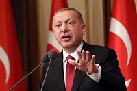 (FILES) In this file photo taken on July 15, 2018 Turkish President Tayyip Erdogan delivers a speech during a ceremony marking the second anniversary of the attempted coup at the Presidential Palace in Ankara, Turkey. - Turkish President Recep Tayyip Erdogan on August 10, 2018 pledged that Turkey would prevail in an "economic war" after the lira crashed to historic lows over Ankara's strains with Washington. (Photo by ADEM ALTAN / AFP)