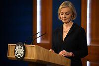 Britain's Prime Minister Liz Truss looks down during a press conference in the Downing Street Briefing Room in central London on October 14, 2022, following the sacking of the finance minister in response to a budget that sparked markets chaos. - Truss dismissed her finance minister, forcing Kwasi Kwarteng to carry the can for turmoil sparked by her right-wing economic platform as restive Conservatives plotted her own demise. (Photo by Daniel LEAL / POOL / AFP)