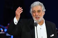 (FILES) In this file photo taken on August 28, 2019 Spanish tenor Placido Domingo performs during his concert in the newly inaugurated sports and culture centre 'St Gellert Forum' in Szeged, southern Hungary. - Domingo, the legendary opera singer facing myriad sexual harassment accusations, is withdrawing from all future performances at New York's Metropolitan Opera, both he and the institution announced on September 24, 2019. The 11th-hour decision comes just one night before the 78-year-old Spaniard dubbed the "king of opera," who denies all allegations, was scheduled to perform in the Met's production of "Macbeth." (Photo by Attila KISBENEDEK / AFP)