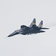 (File) This file photo taken on January 1, 2023 shows a MIG-29 Ukrainian fighter jet flying over eastern Ukraine.  -Slovakia will donate 13 of his MiG-29 fighter jets to Ukraine, the Slovak prime minister said on March 17, 2023.  (Photo by Sameer Al-DOUMY/AFP)