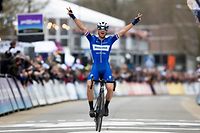 Czech Zdenek Stybar celebrates as he crosses the finish line to win the men's race of 74th edition of the one-day cycling race 'Omloop Het Nieuwsblad', 200km from Merelbeke to Ninove, on March 2, 2019, in Ninove. (Photo by KRISTOF VAN ACCOM / BELGA / AFP) / Belgium OUT