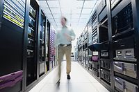 Man working in data center Cyber data server 