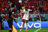 USA's midfielder #06 Yunus Musah vies for the header with USA's midfielder #14 Luca De La Torre (C) during the Qatar 2022 World Cup Group B football match between USA and Wales at the Ahmad Bin Ali Stadium in Al-Rayyan, west of Doha on November 21, 2022. (Photo by Anne-Christine POUJOULAT / AFP)
