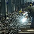 An employee works on steel bars at a factory in Hangzhou, in China's eaastern Zhejiang province on May 15, 2020. - China's industrial output returned to growth for the first time this year in April, official data showed on May 15, but another sharp drop in retail sales indicated crucial consumer demand remains weak, which could scotch hopes for a quick economic recovery. (Photo by STR / AFP) / China OUT