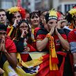 Belgium supporters react after France's scored its first goal as they gather at a fan zone in Brussels on July 10, 2018 to watch the Russia 2018 World Cup semi-final football match between France and Belgium. / AFP PHOTO / Aris Oikonomou