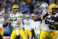 DETROIT, MICHIGAN - JANUARY 09: Aaron Rodgers #12 of the Green Bay Packers looks to pass against the Detroit Lions during the first quarter at Ford Field on January 09, 2022 in Detroit, Michigan.   Mike Mulholland/Getty Images/AFP
== FOR NEWSPAPERS, INTERNET, TELCOS & TELEVISION USE ONLY ==