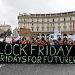Students hold a banner and placards during a demonstration on Piazza della Repubblica in Rome, as part of the Fridays for Future movement for climate change, on November 29, 2019. (Photo by ANDREAS SOLARO / AFP)