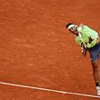 TOPSHOT - Spain's Rafael Nadal serves the ball to Japan's Kei Nishikori during their men's singles quarter-final match on day ten of The Roland Garros 2019 French Open tennis tournament in Paris on June 4, 2019. (Photo by Thomas SAMSON / AFP)